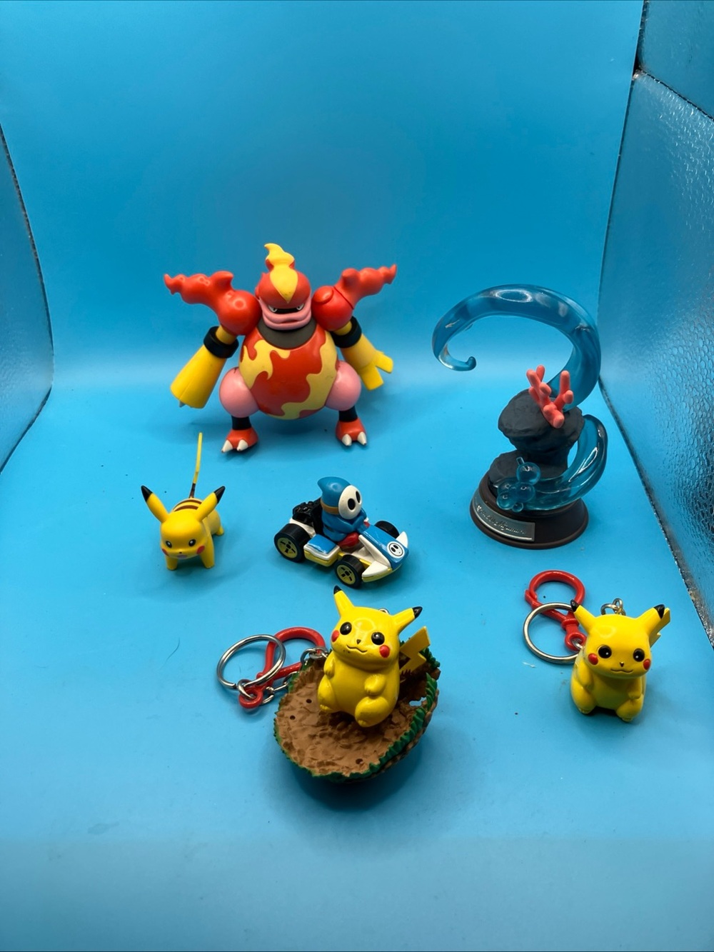 Pokemon Figure Bundle with Yellow Pikachu Keychains and Red-Orange Magmortar